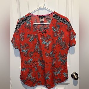 Heartsoul scrub top. Orangish/red Blue flowers . Round neck with mock tie